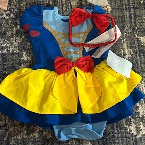 Vibrant Blue and Yellow Kids Costume with Red Bow